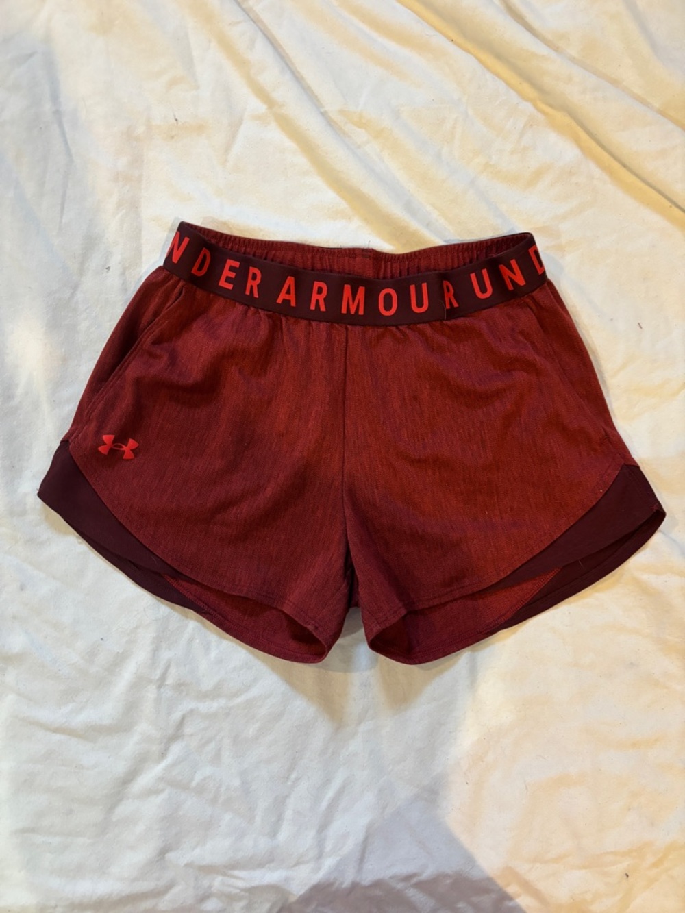 Under Armour loose fitted athletic shorts in deep red